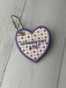 Custom embroidered heart bag tag with “Literally just a girl”